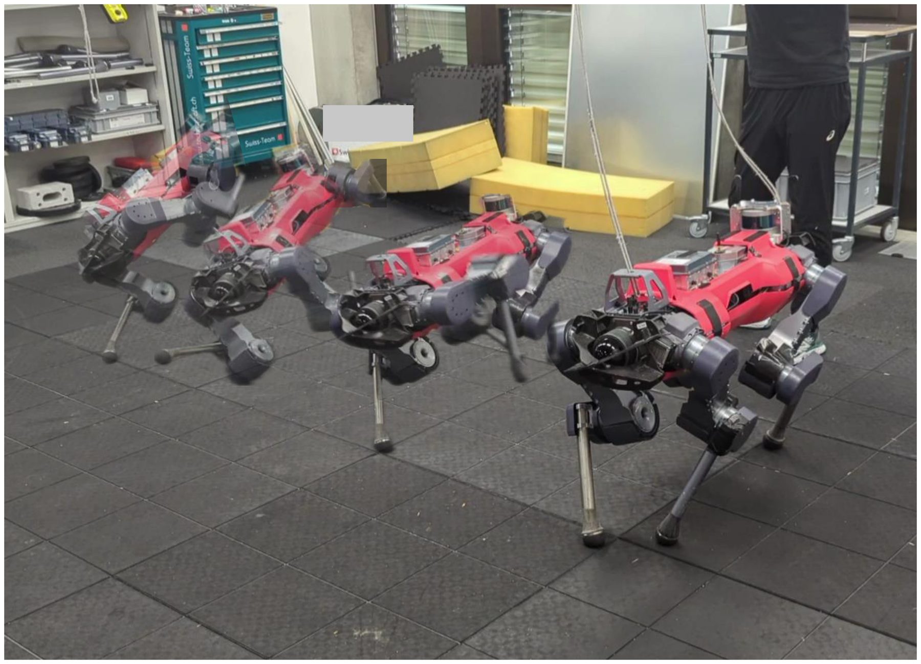 Time-lapse of the ANYmal robot on a lab floor, stumbling and tipping over while being attacked